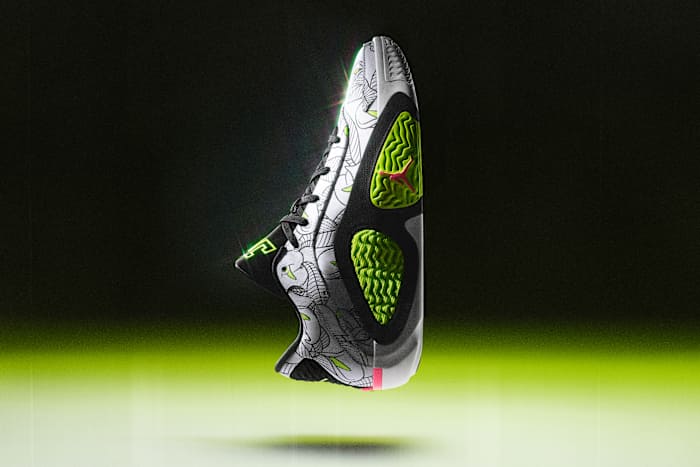 Side view of Jayson Tatum's white and black Jordan Brand shoe.